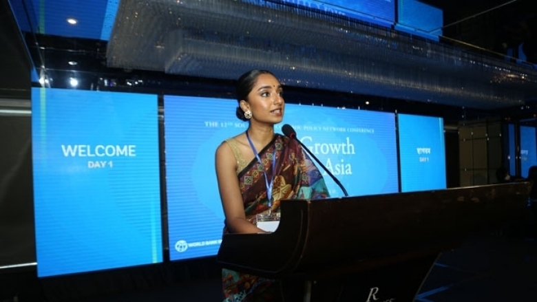 Female in Bangladeshi cultural attire on the podium