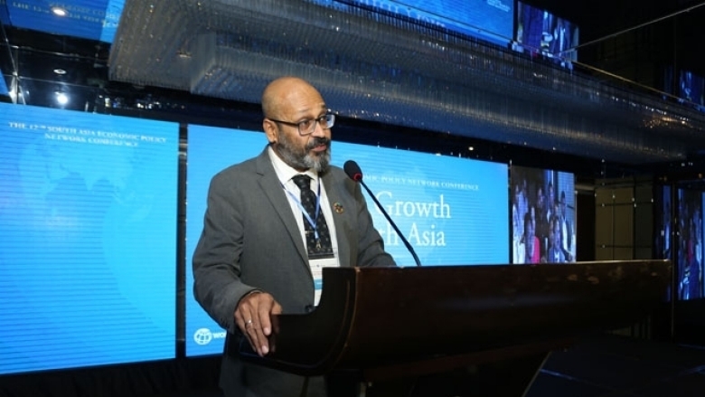 Male in formal attire on the podium