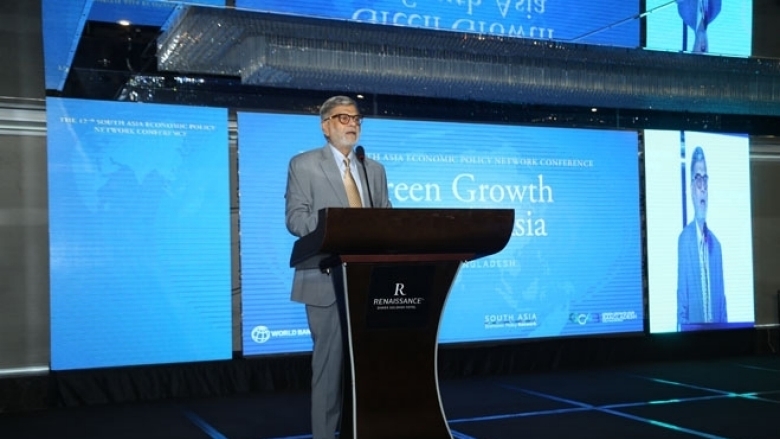 Male in formal attire on the podium