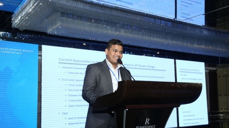 Male in formal attire on the podium