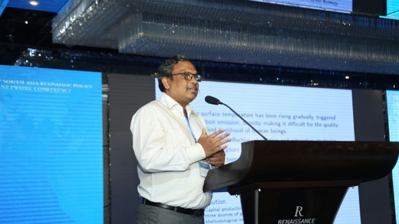 Male in formal attire on the podium