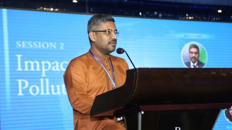 Male in cultural attire on the podium