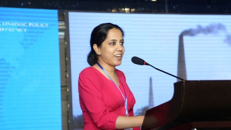 Female in formal attire on the podium