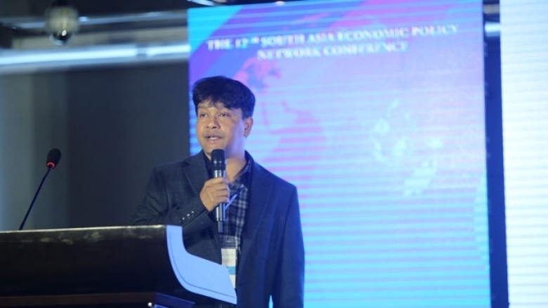 Male in formal attire on the podium