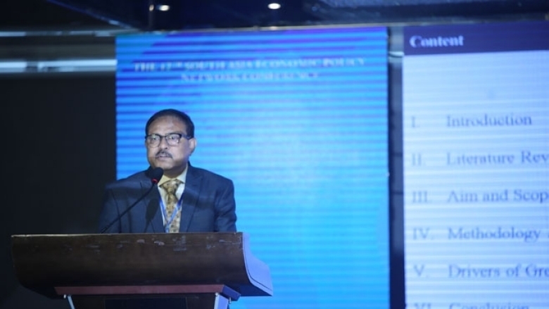 Male in formal attire on the podium