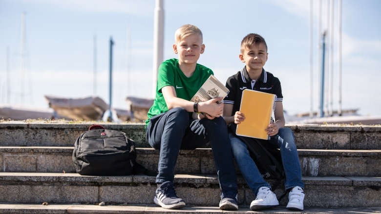 kids sitting on stairs in Tallinn, Estonia