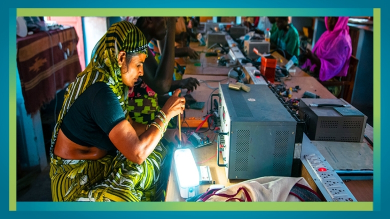 Image Picture of women learning to make solar lanterns in Rajasthan, India.  Women learning to make solar lanterns at Barefoo