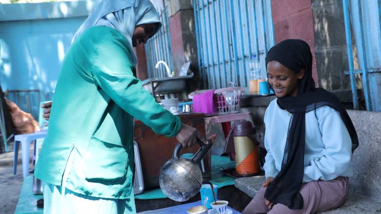 Lubaba Mohammed serves coffee at a public sanitation facility and coffee stand in Addis Ababa, Ethiopia.