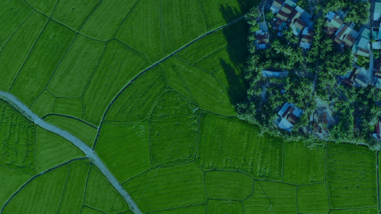 Agricultural field with a residential community on the side