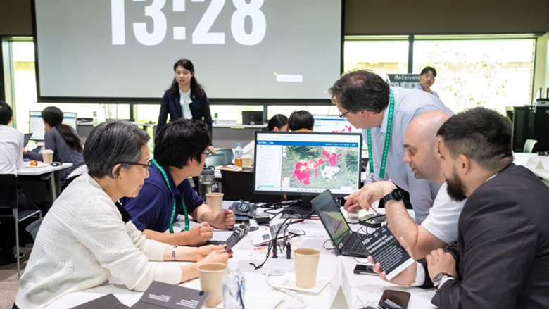 Participants in a planning simulation using a data tool called “Suitability”.