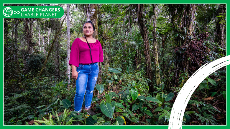 Iliana Jimenez stands in the middle of a vibrant forest in Costa Rica. - with Game Changers branding