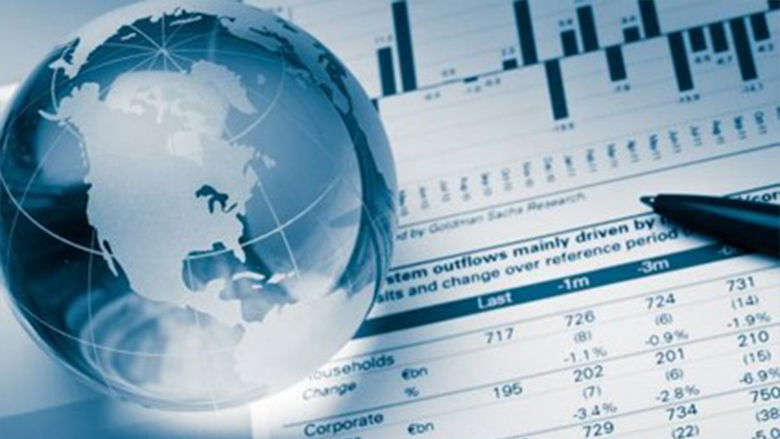 Glass globe and papers with graphs 