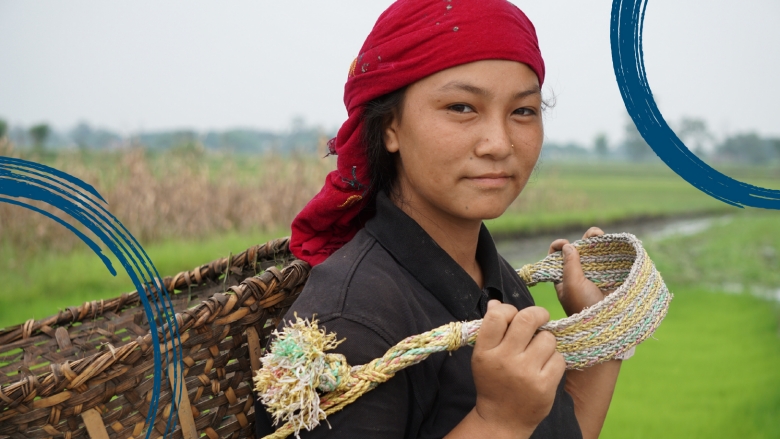 Female carrying a basket working in the farmland 