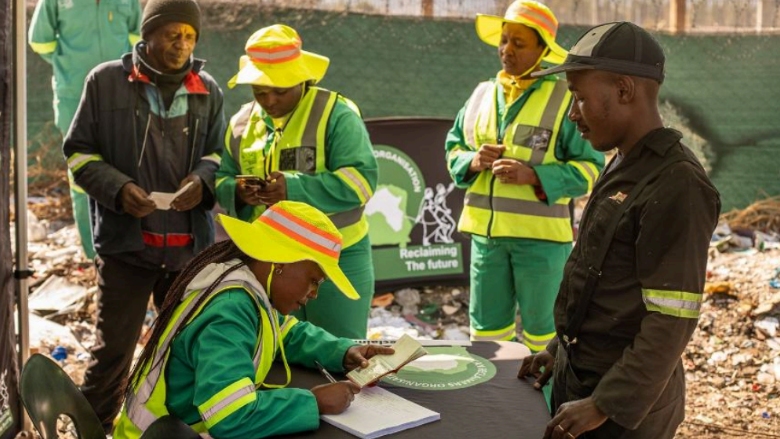 Reclaimers receive cards that register them in the South Africa